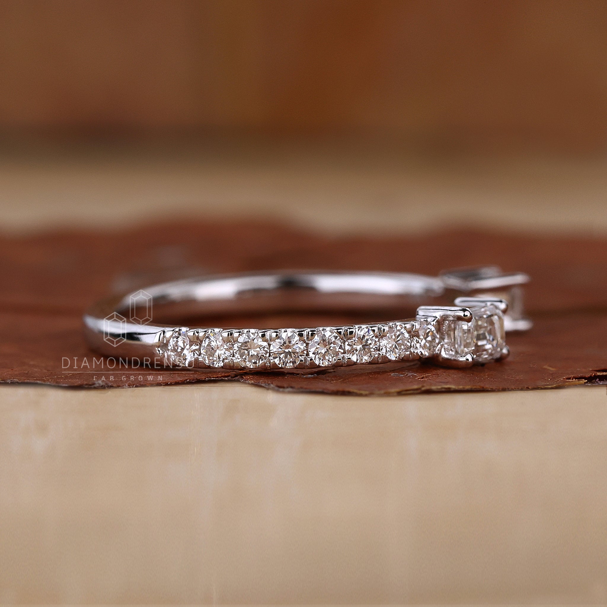 White gold diamond band with a sparkling prong setting.
