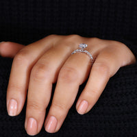 Round and marquise side stones creating a unique setting.
