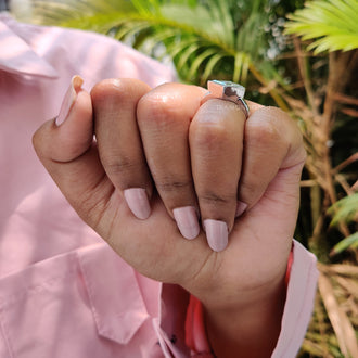 Handmade ring featuring a bezel set moissanite.
