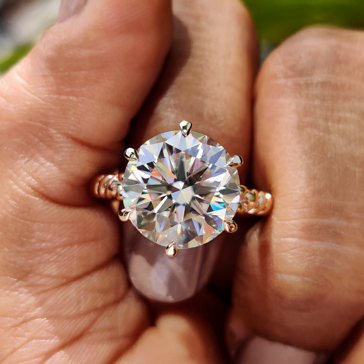 Round cut engagement ring set in a classic solitaire style.
