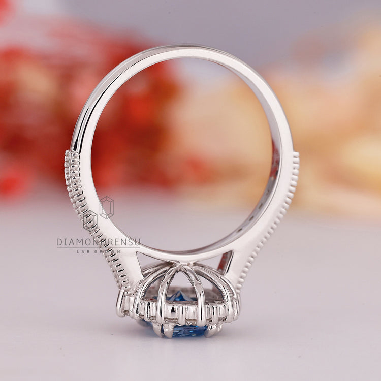 Cathedral setting for radiant cut blue diamond ring

