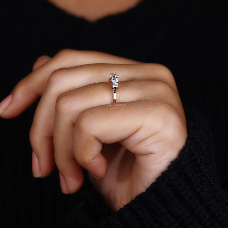 Diamond prong wedding band for modern elegance.
