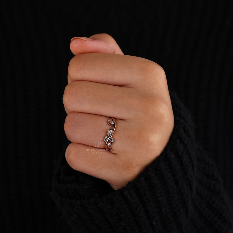 Handmade wedding band with round diamonds in a leaf pattern.
