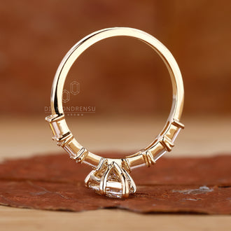 Lab grown diamond marquise ring set in a stunning gold band.
