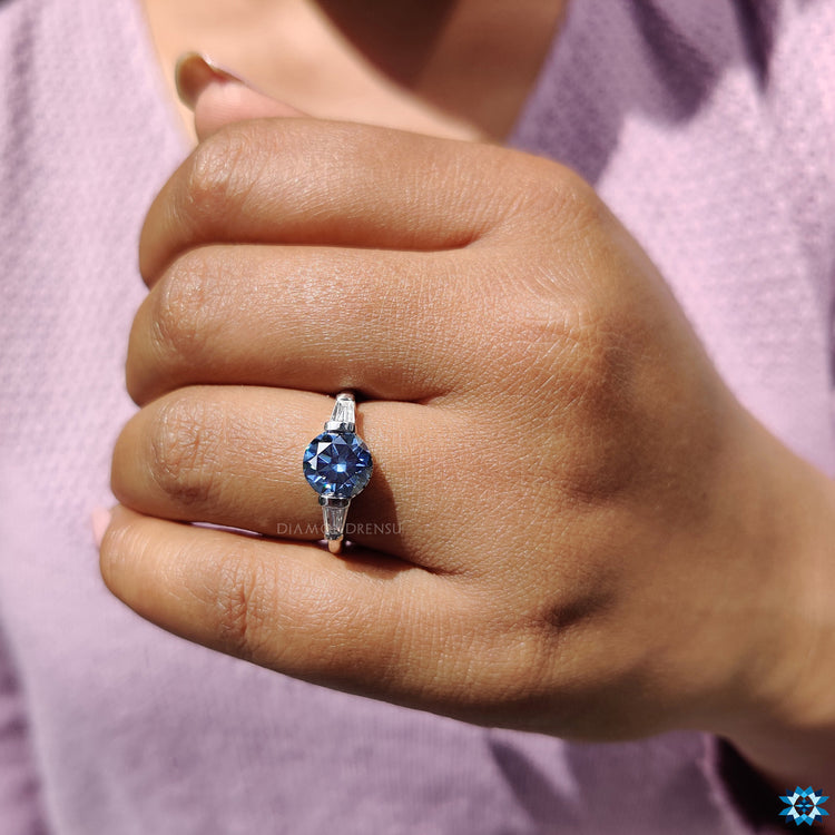 White gold engagement ring with moissanite stones.