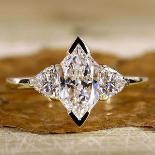 Three stone diamond ring on a model's hand, showcasing its sparkle.
