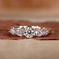 5 stone wedding band with a classic design.
