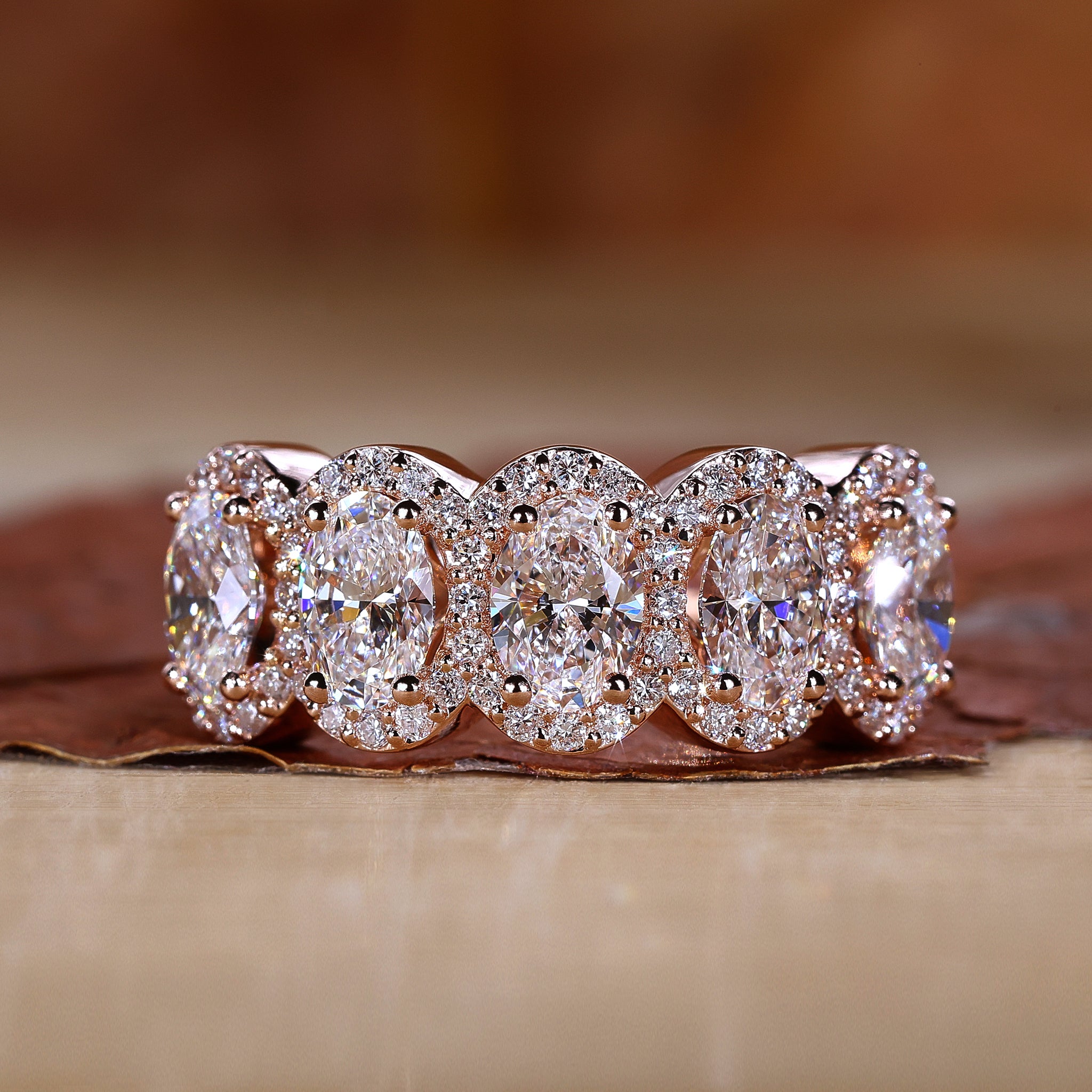 5 stone diamond ring featuring a classic prong setting.
