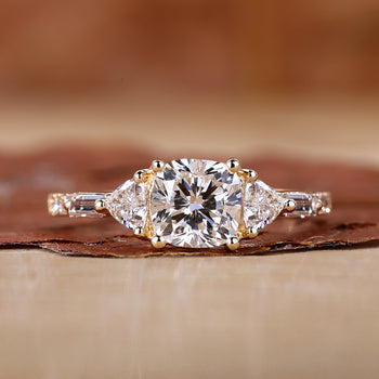 Three Stone Cushion Cut Ring with stunning trillion cut side stones.
