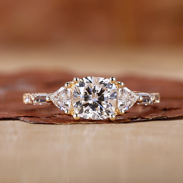 Three Stone Cushion Cut Ring with stunning trillion cut side stones.
