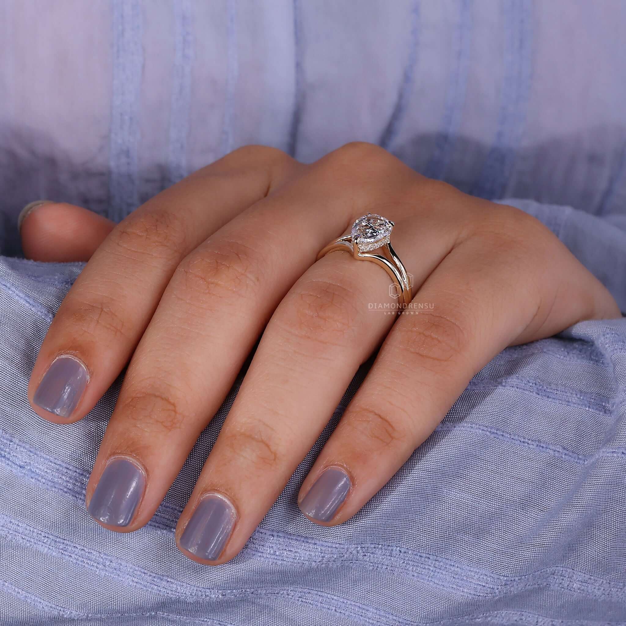 A Split Shank Engagement Ring showcased on a hand for a personalized touch.
