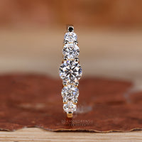 5 round diamond wedding band with prong setting.
