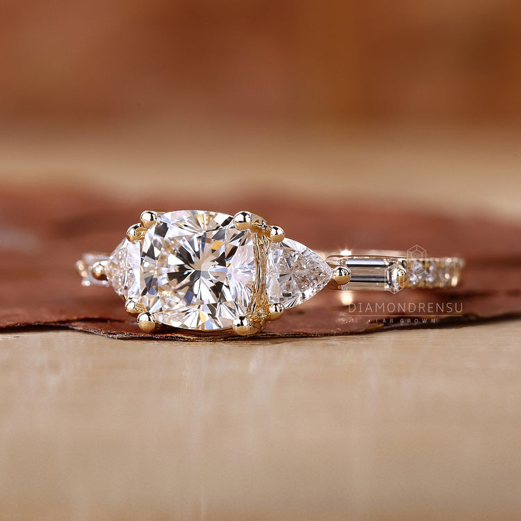 Three Stone Engagement Ring featuring a cushion cut center.