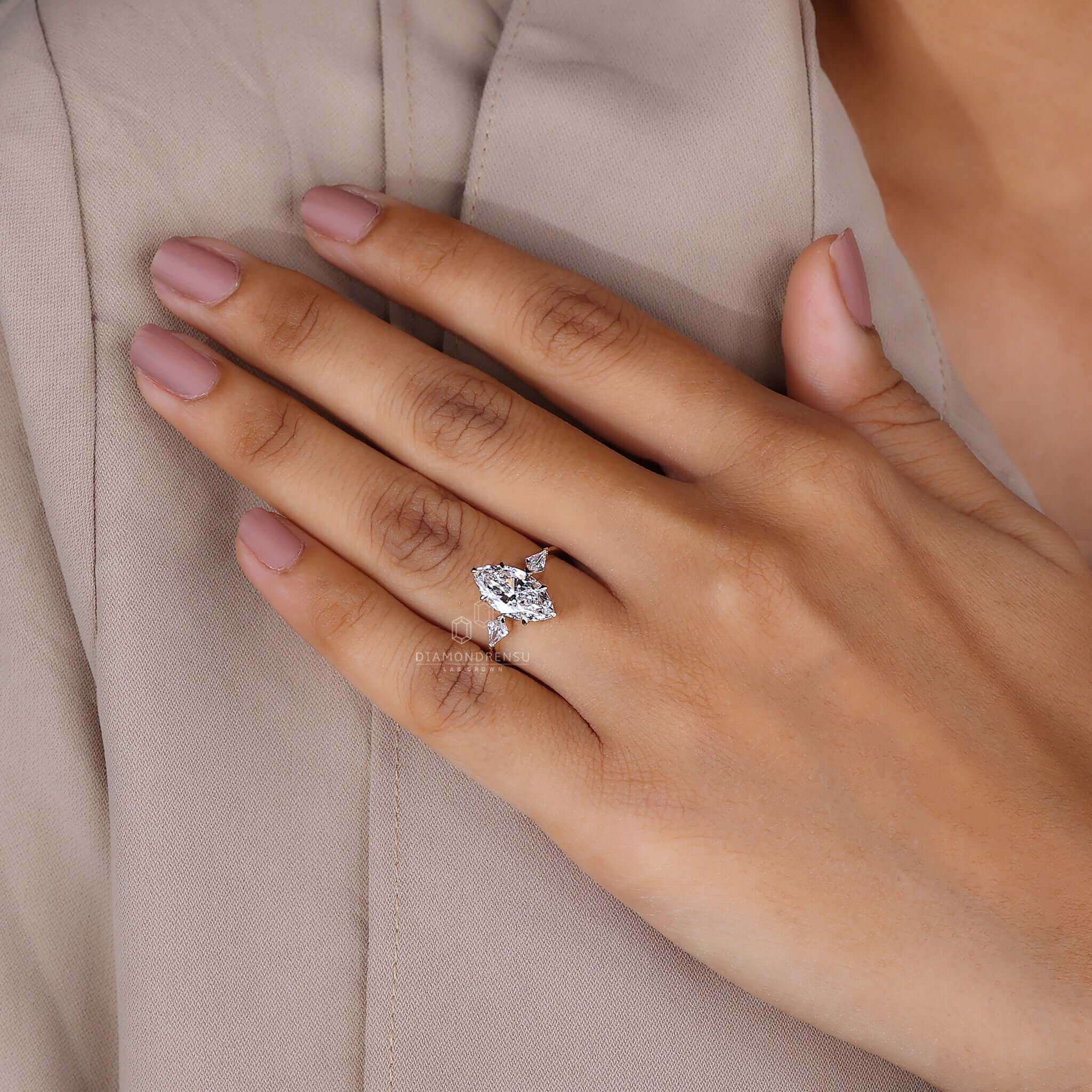 A hand displaying an anniversary gift of a beautiful diamond engagement ring.