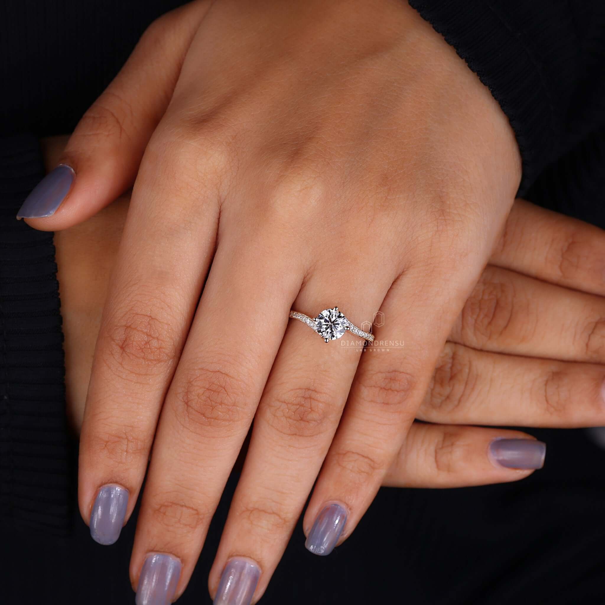Sophisticated bypass diamond ring on a satin background, exuding luxury and style.