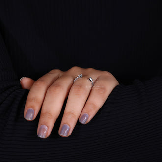 Emerald and round cut diamonds adorn this handmade jewelry.
