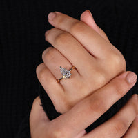 V prong setting engagement ring with a pear-shaped diamond for a unique design.
