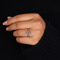 Elegant gold diamond rose ring featuring a brilliant round diamond center.
