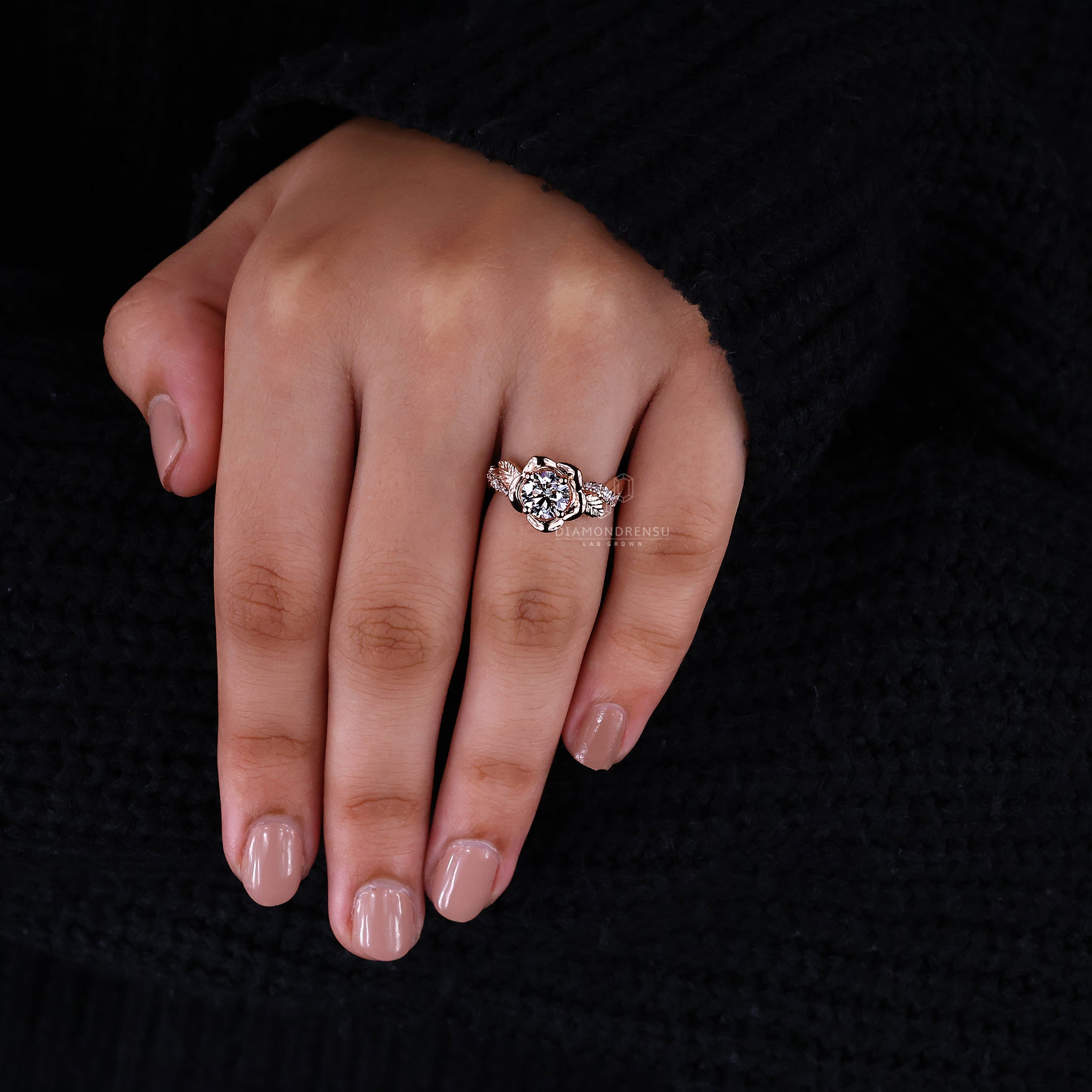 Handmade rose gold engagement rings with a round brilliant cut diamond, featuring a floral diamond ring design