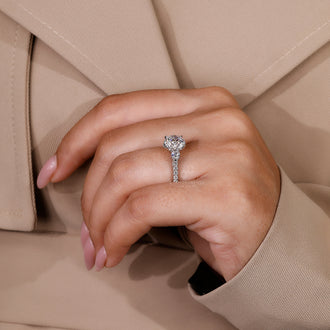 Stunning pave setting ring showcasing a 3 stone round cut diamond.