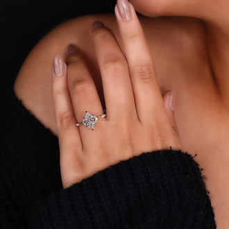 Yellow gold ring featuring Dutch marquise center and round side stones.