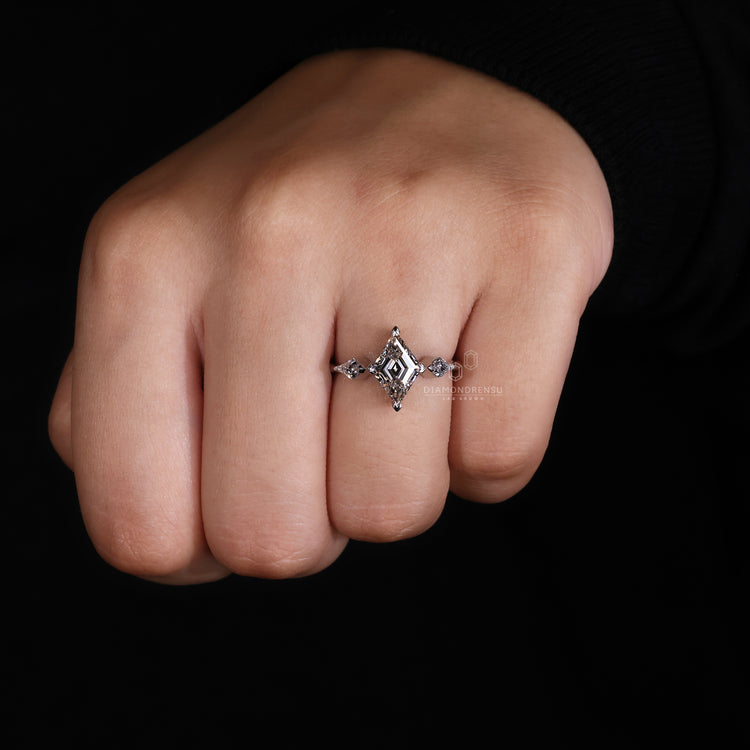 3 Stone Ring with a beautiful kite cut diamond for elegance.