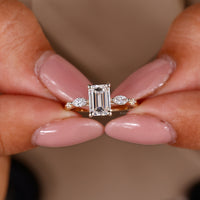 Classic emerald cut engagement ring in a luxurious handmade design.