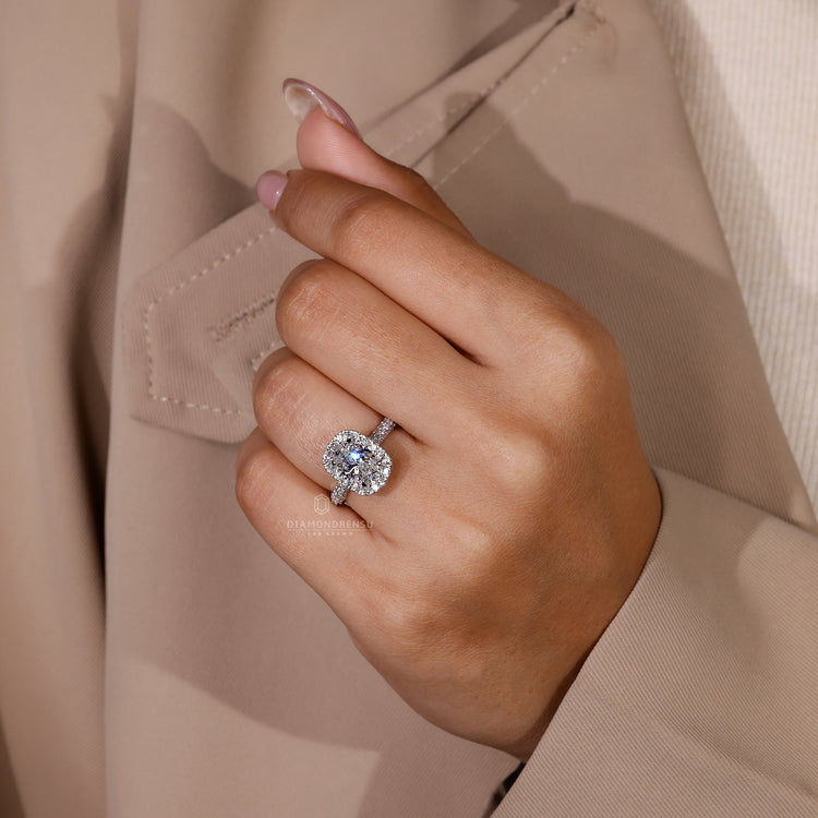 Round cut diamond ring with elegant three sided pave design.