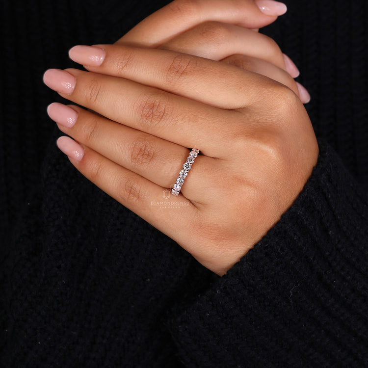 Elegant prong setting wedding band offering secure diamond placement.
