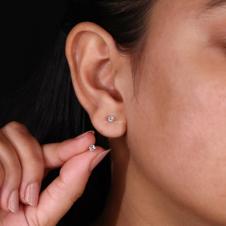 Diamond earrings with prong setting for added security and classic charm.
