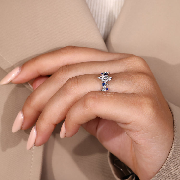 Leaf style pave ring with tanzanite side stones
