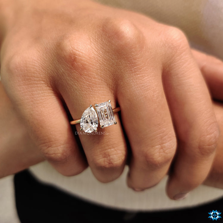 Prong setting engagement ring with moissanite stones.
