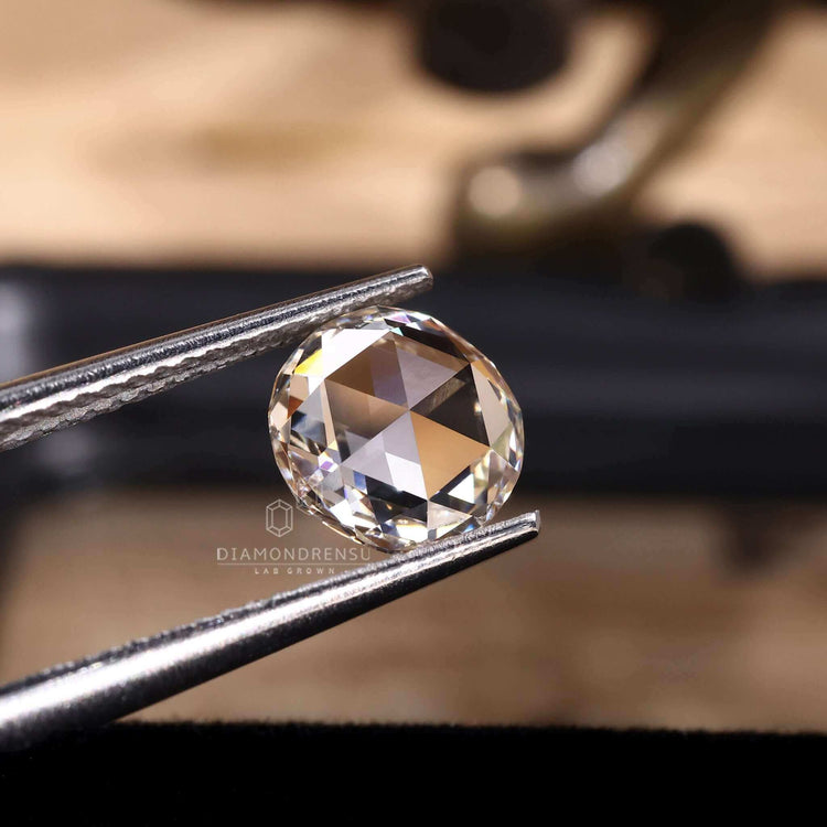 The lab created diamond has a round rose cut shape.
