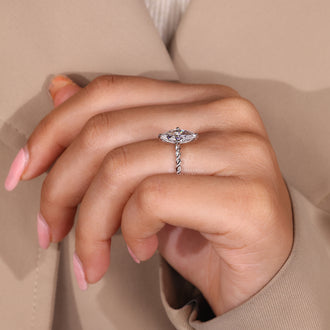 Simple diamond ring with a sleek band, designed for a minimalist look.
