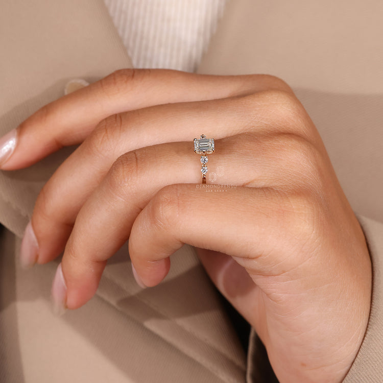 Lab grown emerald and round diamond ring.
