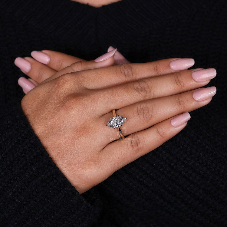 Solitaire Engagement Ring with a sleek, simple band.