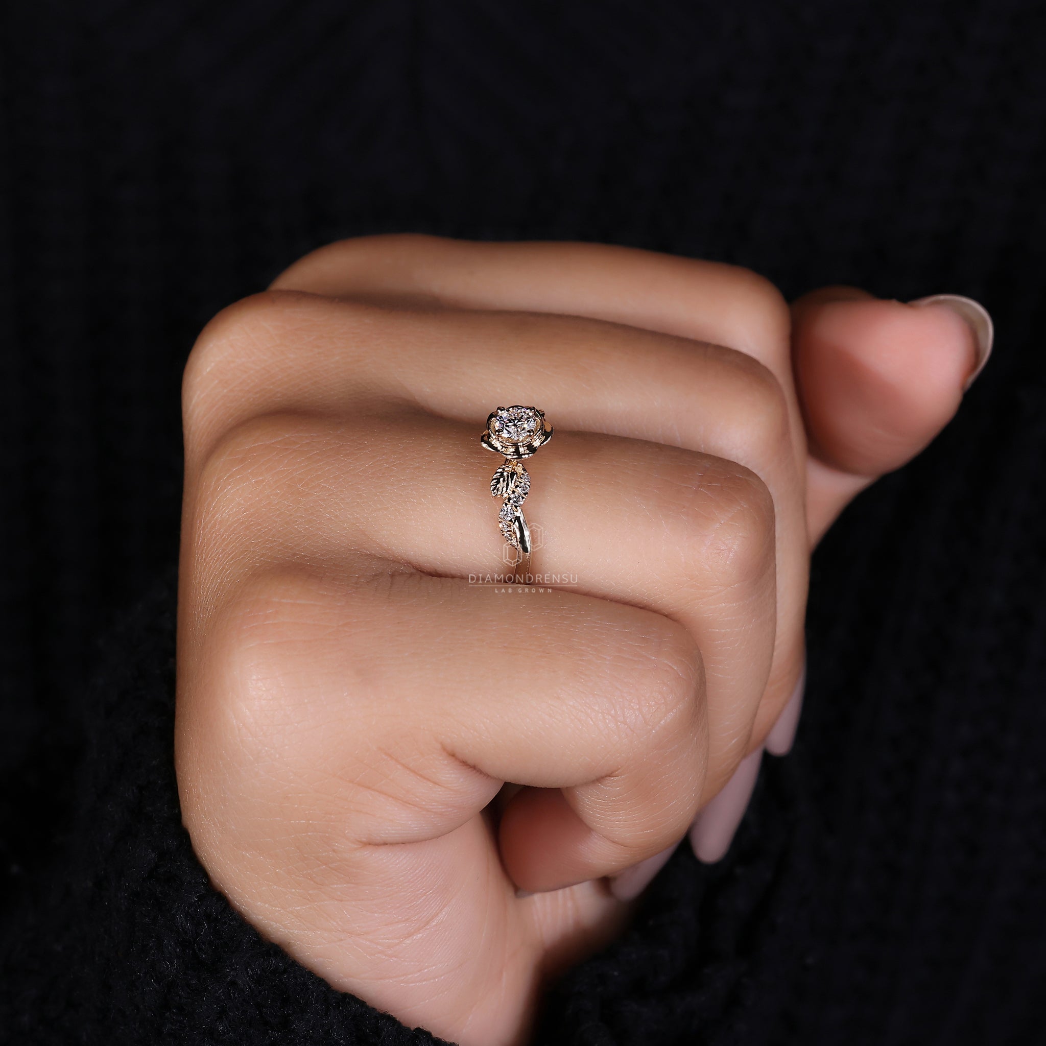 Twisted pave engagement ring with a sparkling round diamond and nature-inspired floral accents