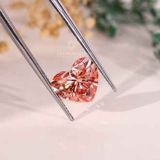 A 4 carat lab grown pink diamond appears in a beautiful heart cut design.
