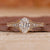 Shimmering Oval Diamond Engagement Ring on Hand, showcasing timeless elegance