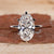 Moval Engagement Ring featuring a brilliant center diamond.