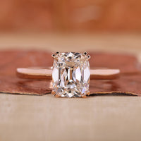 Cushion Cut Solitaire Ring featuring a stunning diamond center.

