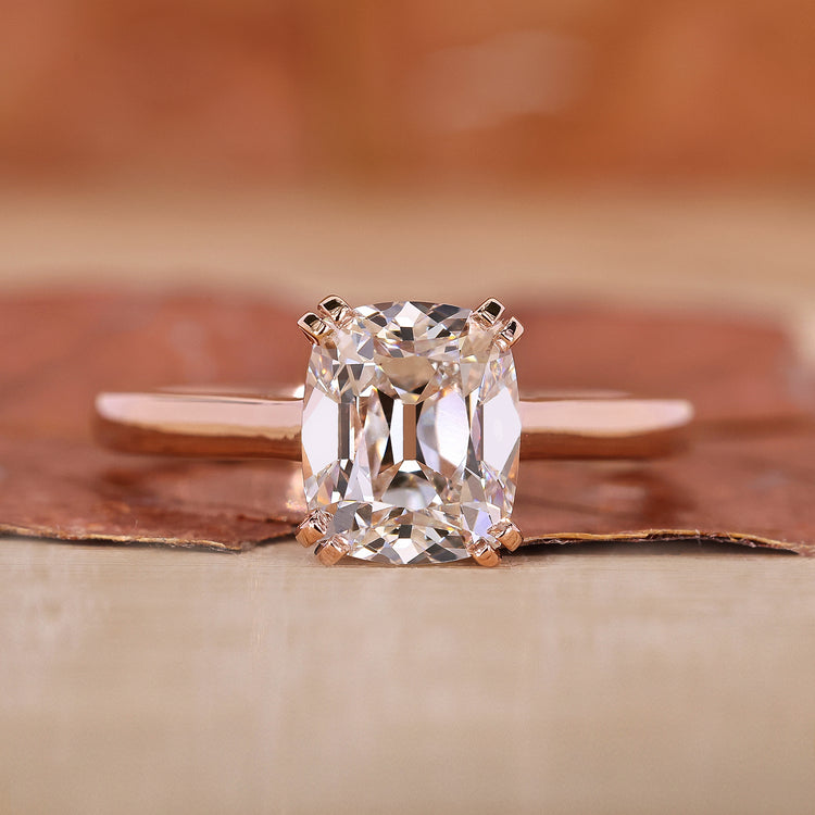 Cushion Cut Solitaire Ring featuring a stunning diamond center.

