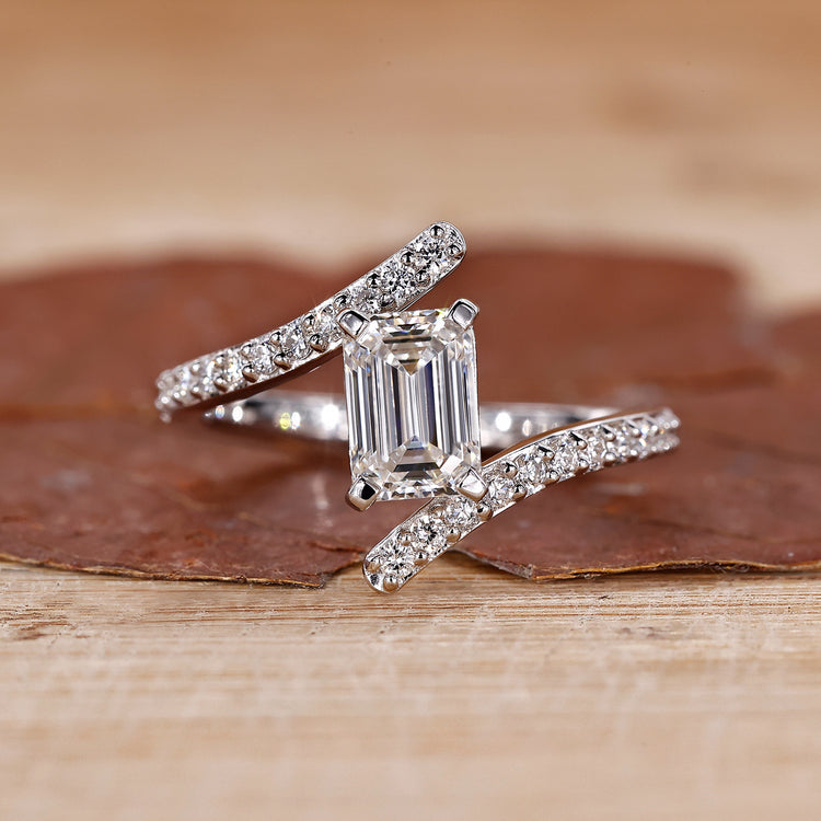 Emerald cut diamond engagement ring with a sleek design.
