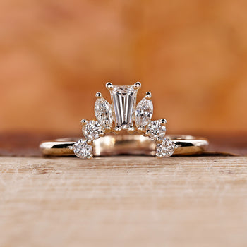 Crown wedding band with intricate design.
