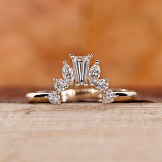 Crown wedding band with intricate design.
