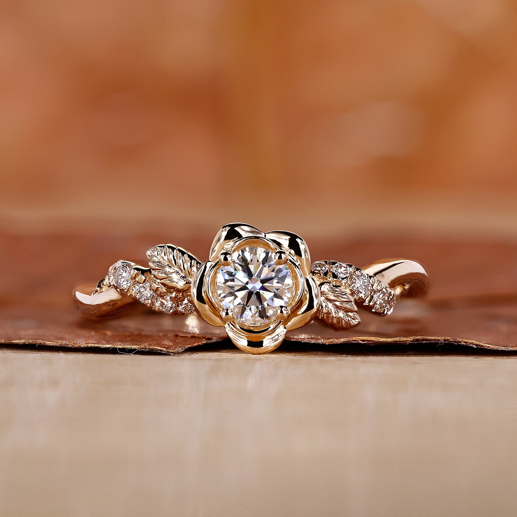 Handmade nature-inspired round diamond engagement ring with floral design and twisted pave band