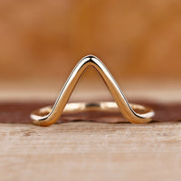 Gold chevron wedding band with a sleek design
