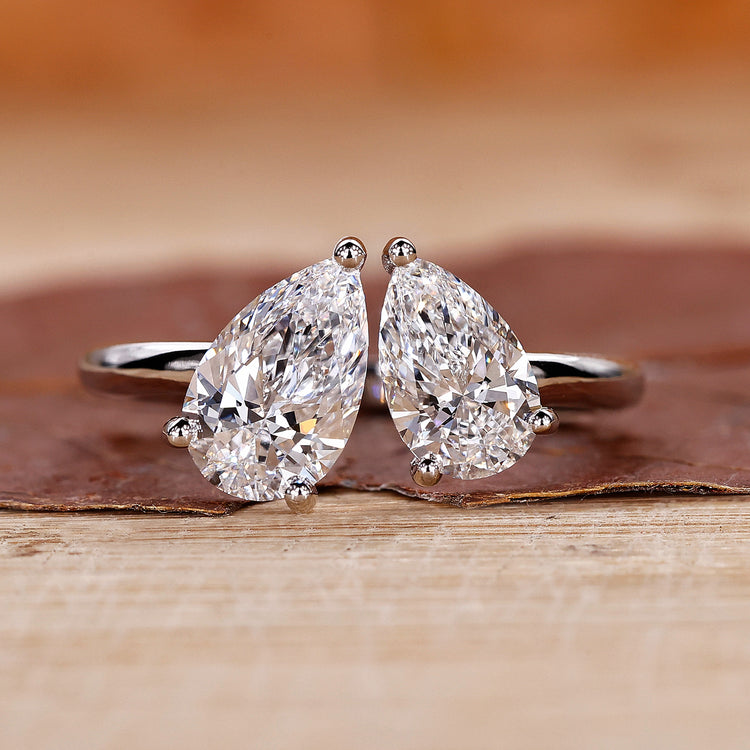 Toi et Moi Engagement Ring featuring a stunning pear shaped diamond.
