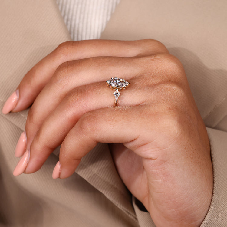 Buy engagement ring with three stone marquise diamond and tapered shank.
