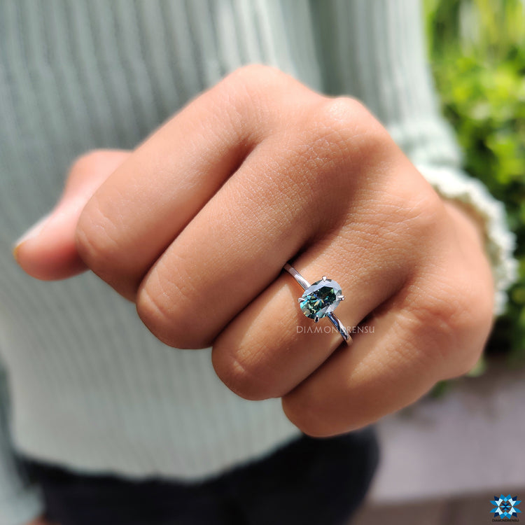 Handmade jewelry with oval moissanite in solitaire design.
